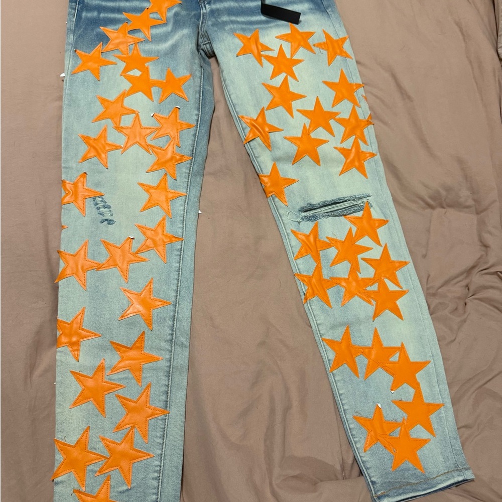 AMIRI Blue Jeans with Orange Star Accents